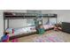 bedroom with bunk beds, carpeted floors, and natural light at 236 Elm Ct, Kissimmee, FL 34759