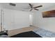 Bright bedroom featuring a ceiling fan, plush carpet, and a modern TV at 236 Elm Ct, Kissimmee, FL 34759