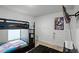 Bright bedroom featuring a black bunk bed, modern gray walls, and stylish decor at 236 Elm Ct, Kissimmee, FL 34759