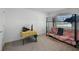 Inviting bedroom features a bunk bed, versatile table, and cozy furnishings at 236 Elm Ct, Kissimmee, FL 34759