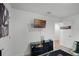 Bright bedroom featuring modern gray walls, a TV, and a spacious dark wood dresser at 236 Elm Ct, Kissimmee, FL 34759