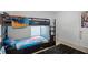 bedroom featuring bunk beds, a window, and a fun superhero theme at 236 Elm Ct, Kissimmee, FL 34759
