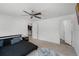 Relaxing primary bedroom with a ceiling fan, an en-suite bathroom, and a walk-in closet at 236 Elm Ct, Kissimmee, FL 34759