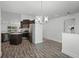 Open-concept dining area connected to a kitchen with stainless steel appliances at 236 Elm Ct, Kissimmee, FL 34759
