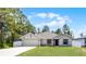 Charming single Gathering home with well-maintained lawn and attached two car garage at 236 Elm Ct, Kissimmee, FL 34759