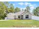 Charming single-story home with a well-manicured lawn and a two-car garage at 236 Elm Ct, Kissimmee, FL 34759