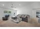 Spacious living room with neutral carpet, ceiling fan, and lots of natural light at 236 Elm Ct, Kissimmee, FL 34759