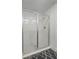Enclosed glass shower with white tile and modern showerhead at 236 Elm Ct, Kissimmee, FL 34759