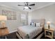 Cozy bedroom with plush bedding, decorative pillows, and a side table with a table lamp at 243 Sagecrest Dr, Ocoee, FL 34761