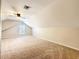 Spacious bonus room with neutral carpet, ceiling fan, and a window allowing natural light at 243 Sagecrest Dr, Ocoee, FL 34761