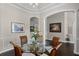 Elegant dining room with hardwood flooring, decorative molding, and natural light at 243 Sagecrest Dr, Ocoee, FL 34761