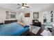 Spacious main bedroom with dark wood floors, ceiling fan, and a view to the outside at 243 Sagecrest Dr, Ocoee, FL 34761