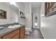 Bathroom featuring a single sink vanity, toilet and glass enclosed shower at 248 Wallrock Ct, Ocoee, FL 34761