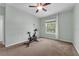 Bedroom with a large window and a bike at 248 Wallrock Ct, Ocoee, FL 34761