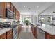 Modern kitchen with stainless steel appliances, granite countertops, and ample cabinet space for storage at 248 Wallrock Ct, Ocoee, FL 34761