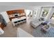 Open-concept kitchen with island, quartz countertops, stainless steel appliances, and eat-in dining area at 248 Wallrock Ct, Ocoee, FL 34761