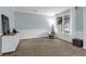 Inviting living room featuring elegant decor, large windows, and plenty of space for relaxation and entertaining at 248 Wallrock Ct, Ocoee, FL 34761