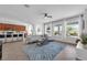 Open-concept living area with a modern kitchen, dining space, and comfortable seating, perfect for entertaining at 248 Wallrock Ct, Ocoee, FL 34761