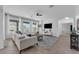 Spacious living room with large windows and modern furniture, offering a bright and inviting atmosphere at 248 Wallrock Ct, Ocoee, FL 34761