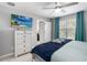 Inviting bedroom with a plush bed, dresser, and bright windows, creating a relaxing ambiance at 2509 Archfeld Blvd, Kissimmee, FL 34746