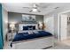 Comfortable bedroom with a large bed, bedside tables, and a tranquil color scheme at 2509 Archfeld Blvd, Kissimmee, FL 34746