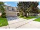 Two-story home with a large front yard and well-maintained landscaping at 2509 Archfeld Blvd, Kissimmee, FL 34746