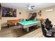 Spacious game room with foosball, pool table, basketball hoop, and comfortable seating at 2509 Archfeld Blvd, Kissimmee, FL 34746