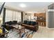 Open-concept living room features a living area and kitchen, creating an ideal space for entertaining guests at 2509 Archfeld Blvd, Kissimmee, FL 34746