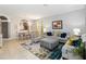Bright living room with coordinated decor, dining area, and lots of natural light at 2509 Archfeld Blvd, Kissimmee, FL 34746