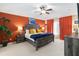 Spacious main bedroom with a large bed, bright paint, and colorful décor creating a vibrant space at 2509 Archfeld Blvd, Kissimmee, FL 34746