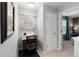 Charming office nook with modern chair, desk and round window letting in plenty of natural light at 2509 Archfeld Blvd, Kissimmee, FL 34746