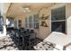 Covered patio area featuring ceiling fan and Mickey Mouse themed decor at 2509 Archfeld Blvd, Kissimmee, FL 34746