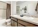 The bathroom features a double sink vanity with granite countertop, shower, and bath at 254 Andalusia Loop, Davenport, FL 33837