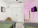 Modern bedroom with two twin beds, closet, and heart decoration at 254 Andalusia Loop, Davenport, FL 33837