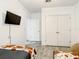 Modern bedroom with closet and flatscreen television at 254 Andalusia Loop, Davenport, FL 33837