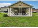 Community area with picnic tables, seating, and well-maintained landscaping at 254 Andalusia Loop, Davenport, FL 33837