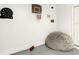 Playful garage corner features a dartboard, basketball hoop, and comfy beanbag chair at 254 Andalusia Loop, Davenport, FL 33837