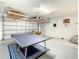Spacious garage with games, ping pong table and additional storage solutions at 254 Andalusia Loop, Davenport, FL 33837