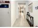 Bright hallway featuring tile flooring, neutral walls, and decorative accents and decor at 254 Andalusia Loop, Davenport, FL 33837