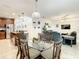Spacious open-concept layout connecting the dining area, kitchen with island, and living room for seamless entertaining at 254 Andalusia Loop, Davenport, FL 33837