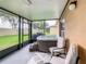 Relax in the screened patio with a hot tub and comfortable seating area at 254 Andalusia Loop, Davenport, FL 33837