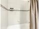 The bathroom features a shower with tile backsplash at 254 Andalusia Loop, Davenport, FL 33837