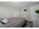 Bedroom with neutral walls and plush carpet, featuring a wall-mounted TV bracket at 2613 Camden Park Loop, Davenport, FL 33837