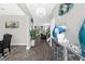 Inviting foyer with elegant chandelier, decorative mirror, luxury flooring, and view of staircase and living room at 2613 Camden Park Loop, Davenport, FL 33837