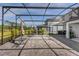 Enjoy the screened-in lanai with brick flooring, perfect for outdoor relaxation and entertaining at 2613 Camden Park Loop, Davenport, FL 33837