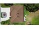 Aerial view of house showing roof detail, landscaping, and circular driveway at 26901 Racquet Cir, Leesburg, FL 34748