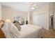 Bright bedroom featuring tiled floors, a window seat, and a double-door closet at 26901 Racquet Cir, Leesburg, FL 34748