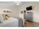 Cozy bedroom featuring vaulted ceilings, tiled floor, and walk-in closet at 26901 Racquet Cir, Leesburg, FL 34748