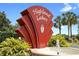 Community entrance sign for Highland Lakes with lush landscaping and water fountain at 26901 Racquet Cir, Leesburg, FL 34748