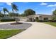 This home includes mature trees and landscaping, a circular drive, and a two car garage at 26901 Racquet Cir, Leesburg, FL 34748